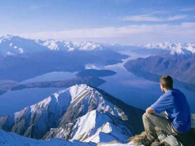 A hiker takes in views over Lake Wanaka