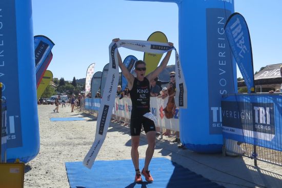 Men’s standard distance winner Malcolm King crosses the line