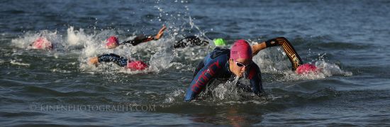 Swimmers exit the water