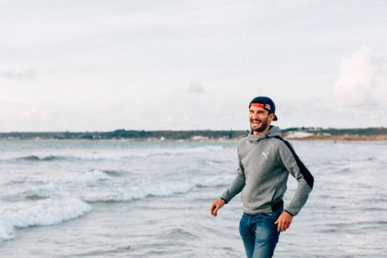 Richard Murray enjoys a lighthearted moment at St. Ouen's Bay on Jersey Island