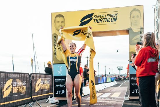 Katie Zaferes crosses the finish line